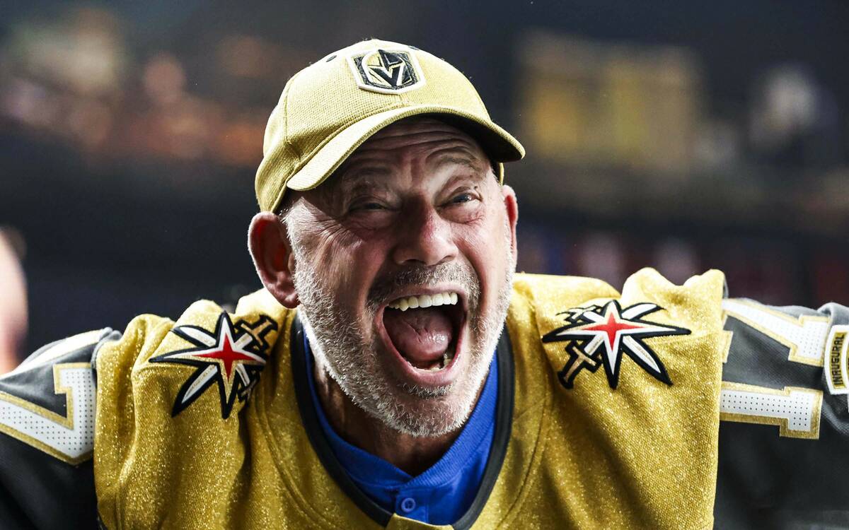 Fans cheer for the Golden Knights during an NHL hockey game against the Nashville Predators Wed ...