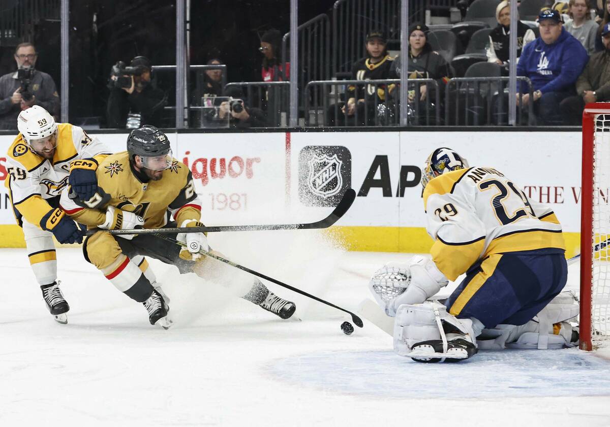 Golden Knights left wing Brandon Saad (20) shoots against Nashville Predators goaltender Justus ...