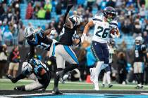 Seattle Seahawks running back Zach Charbonnet scores against the Carolina Panthers during the s ...