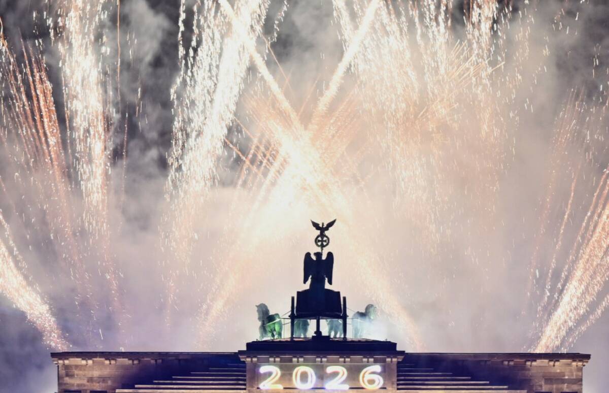 Fireworks can be seen above the Brandenburg Gate at the "Yeah 26" New Year's Eve event, in Berl ...
