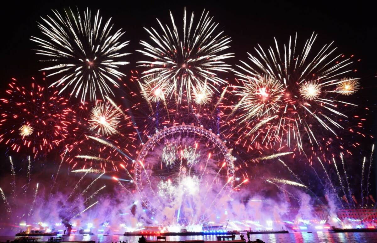 Fireworks light-up the sky in central London to celebrate the New Year on Thursday, Jan. 1, 202 ...