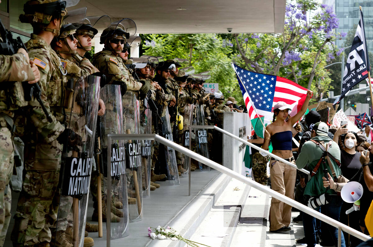 Protesters stand off against California National Guard soldiers at the Federal Building in down ...