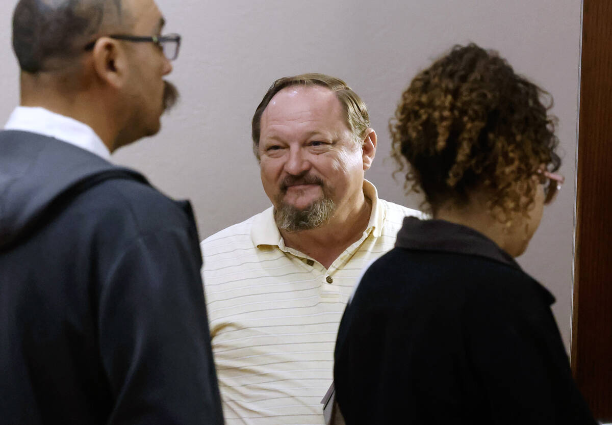 Gregory Brown, a Las Vegas process server, waits to serve papers to someone at the Regional Jus ...