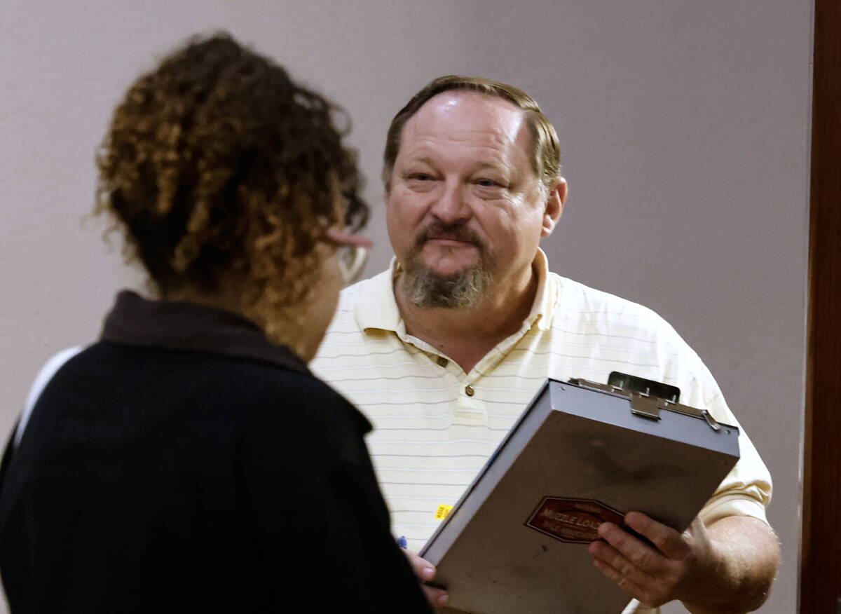 Gregory Brown, a Las Vegas process server, waits to serve papers to someone at the Regional Jus ...