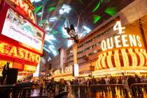 New Year's Eve revelers gather at the Fremont Street Experience on Wednesday, Dec. 31, 2025, in ...
