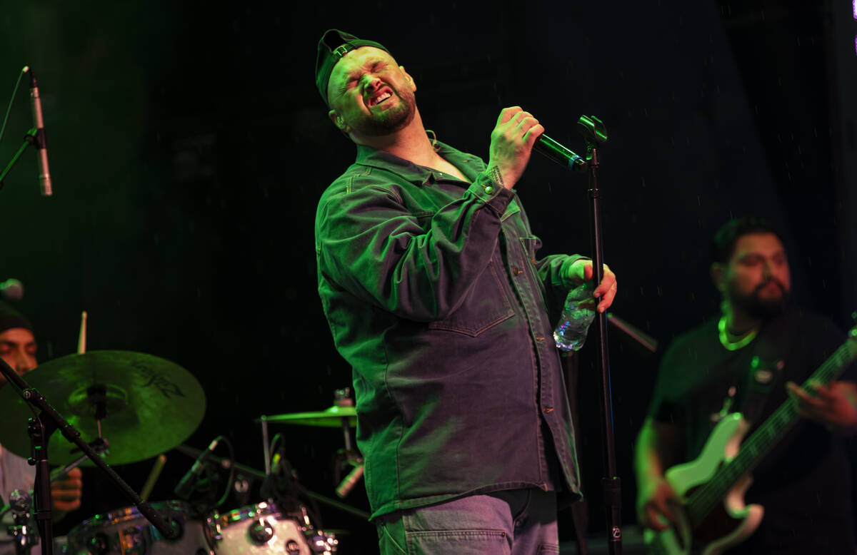 Sammy Johnson performs as New Year's revelers gather at the Fremont Street Experience on W ...