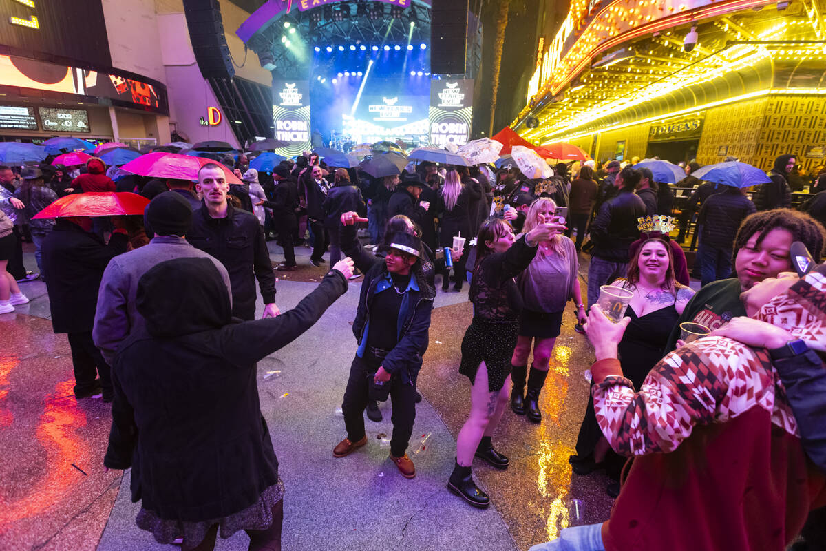 New Year's revelers dance at the Fremont Street Experience on Wednesday, Dec. 31, 2025, in ...