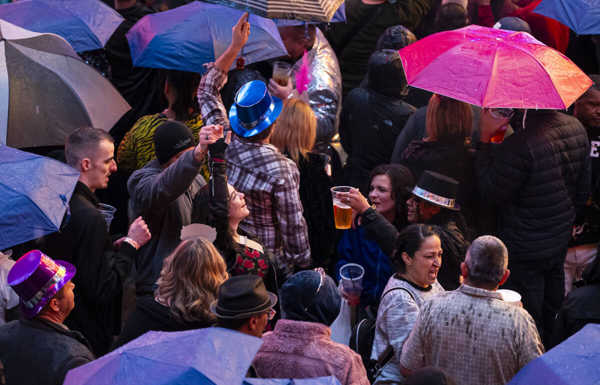 New Year's revelers dance at the Fremont Street Experience on Wednesday, Dec. 31, 2025, in ...