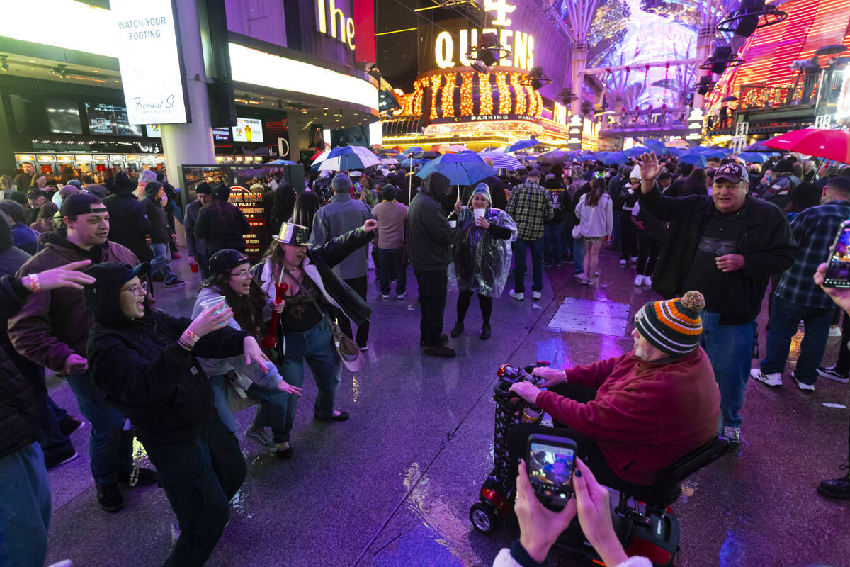 People dance and celebrate the new year at the Fremont Street Experience on Thursday, Jan. 1, 2 ...