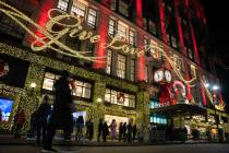 Shoppers wait in line to enter Macy's flagship store on Nov. 28, 2025 in New York. (AP Photo/An ...