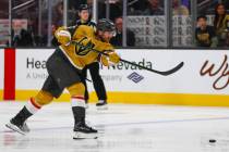 Golden Knights defenseman Noah Hanifin (15) shoots the puck during the third period on Thursday ...