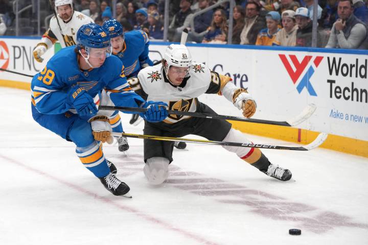 St. Louis Blues' Otto Stenberg (28) and Vegas Golden Knights' Brett Howden (21) chase ...