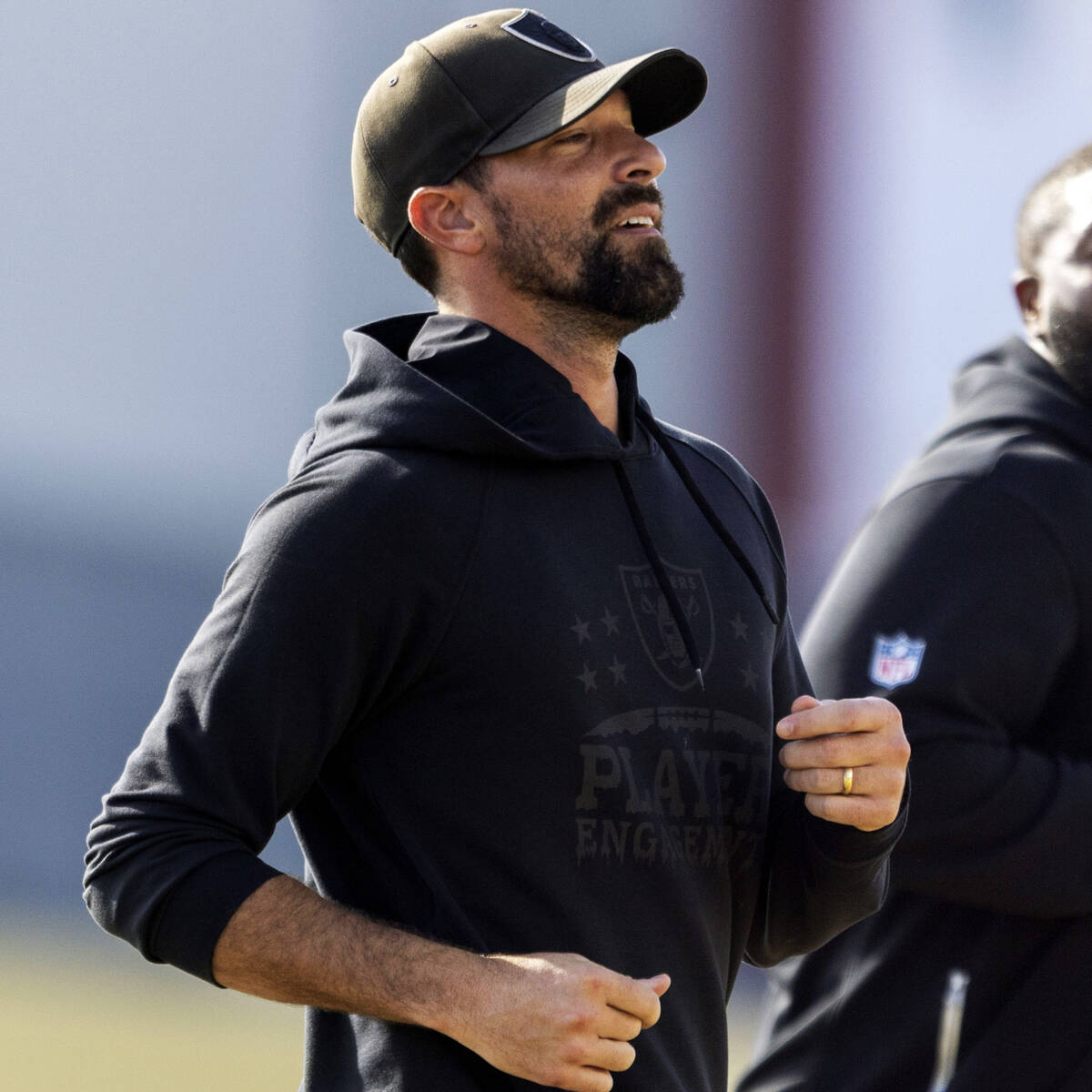 Raiders defensive line coach Rob Leonard jogs during the team’s practice at the Intermou ...