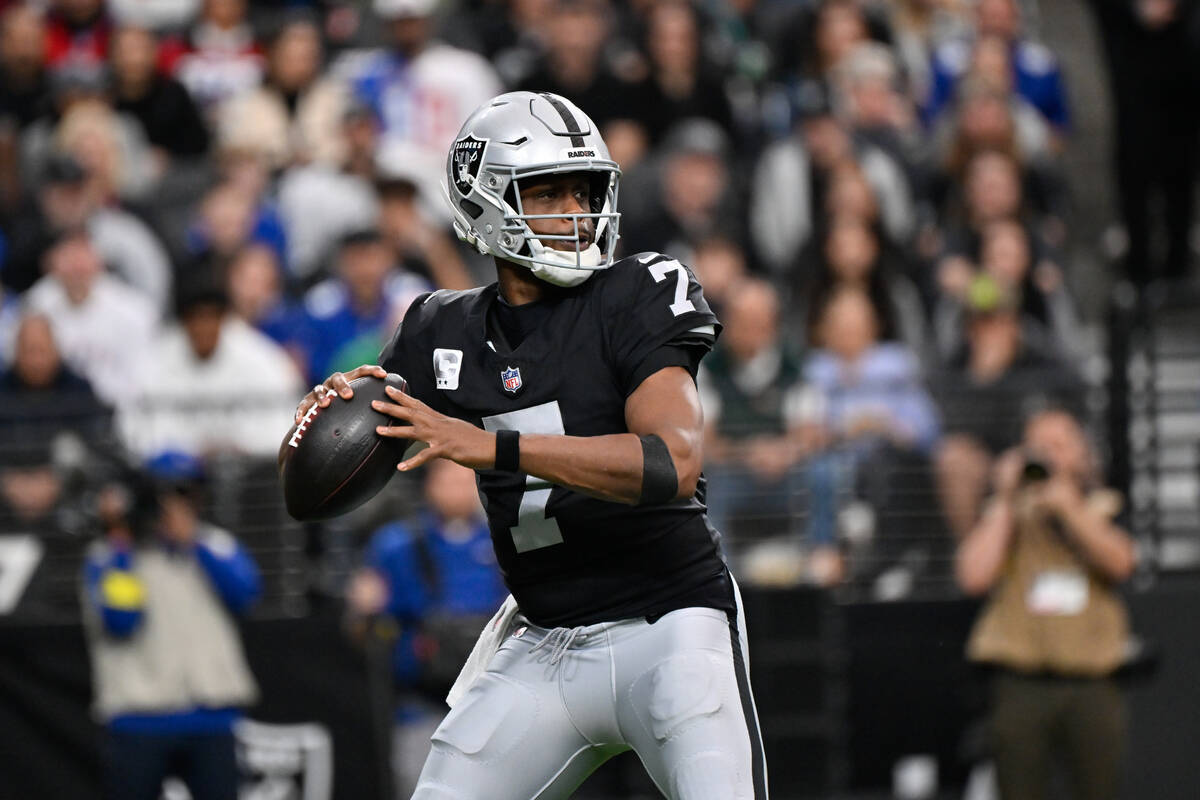 Las Vegas Raiders quarterback Geno Smith throws a pass during the first half of an NFL football ...