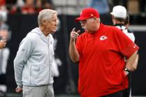 Raiders head coach Pete Carroll chats with the Kansas City Chiefs head coach Andy Reid before a ...