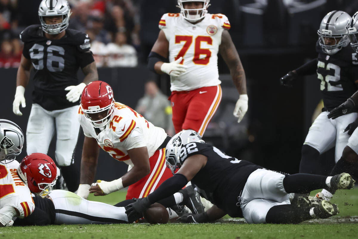Raiders defensive tackle JJ Pegues (92) dives for the ball after a fumble by Kansas City Chiefs ...