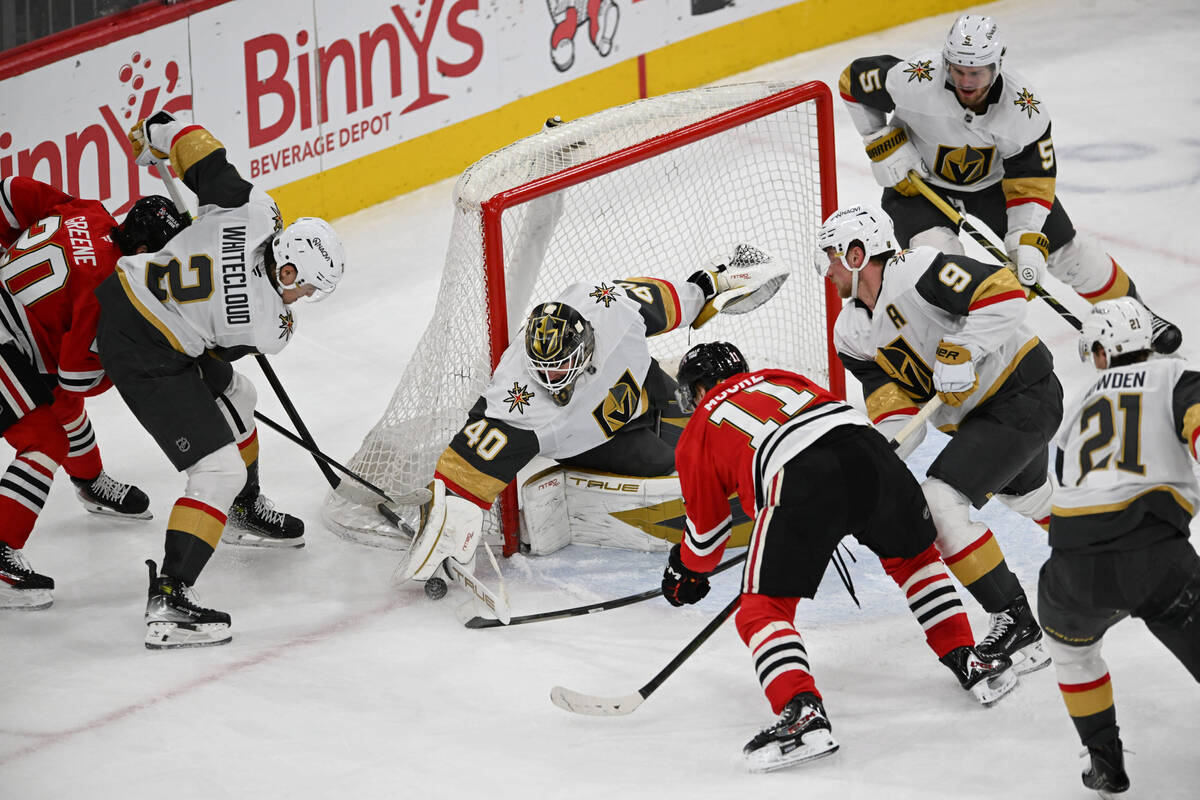 Vegas Golden Knights goalie Akira Scmid, (40) makes a save against Chicago Blackhawks' Oli ...