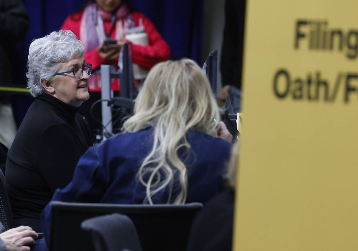 Family Judge Mary Perry, center, files her candidacy as Judge as the official filing opens Mond ...