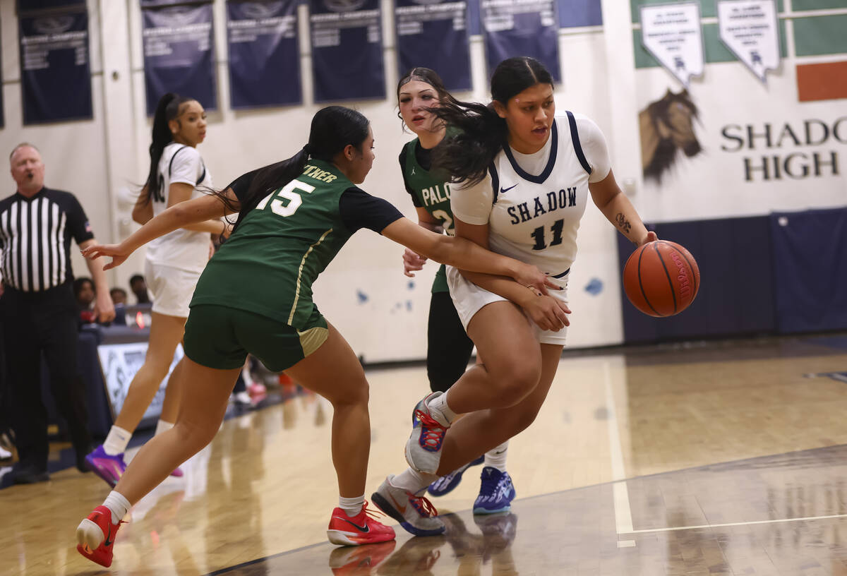 Shadow Ridge center Alofa Martinez (11) drives the ball between Palo Verde’s Madeline Ts ...