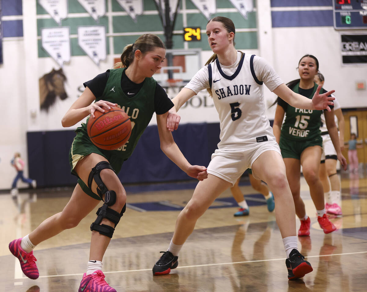 Palo Verde’s Reagan Nehls (20) drives to the basket against Shadow Ridge forward Alexa M ...