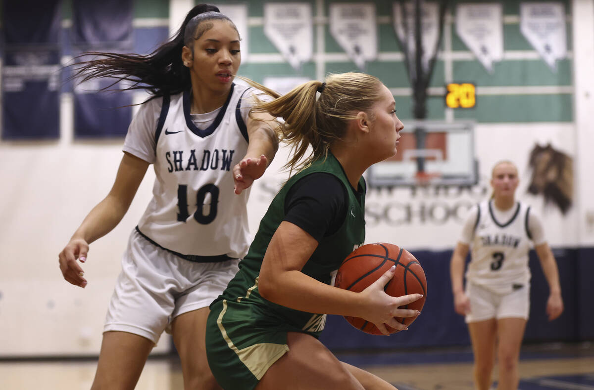 Palo Verde center Maria Paim (12) drives to the basket past Shadow Ridge forward Jaslyn Jeffers ...