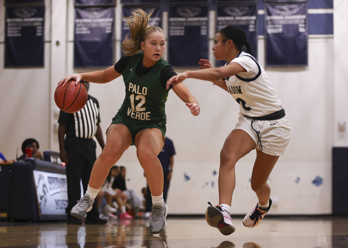 Palo Verde center Maria Paim (12) brings the ball up court against Shadow Ridge guard Ava Willi ...