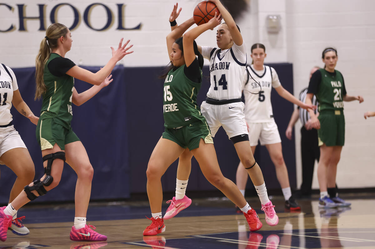 Palo Verde’s Madeline Tsui (15) looks to pass the ball under pressure from Shadow Ridge& ...