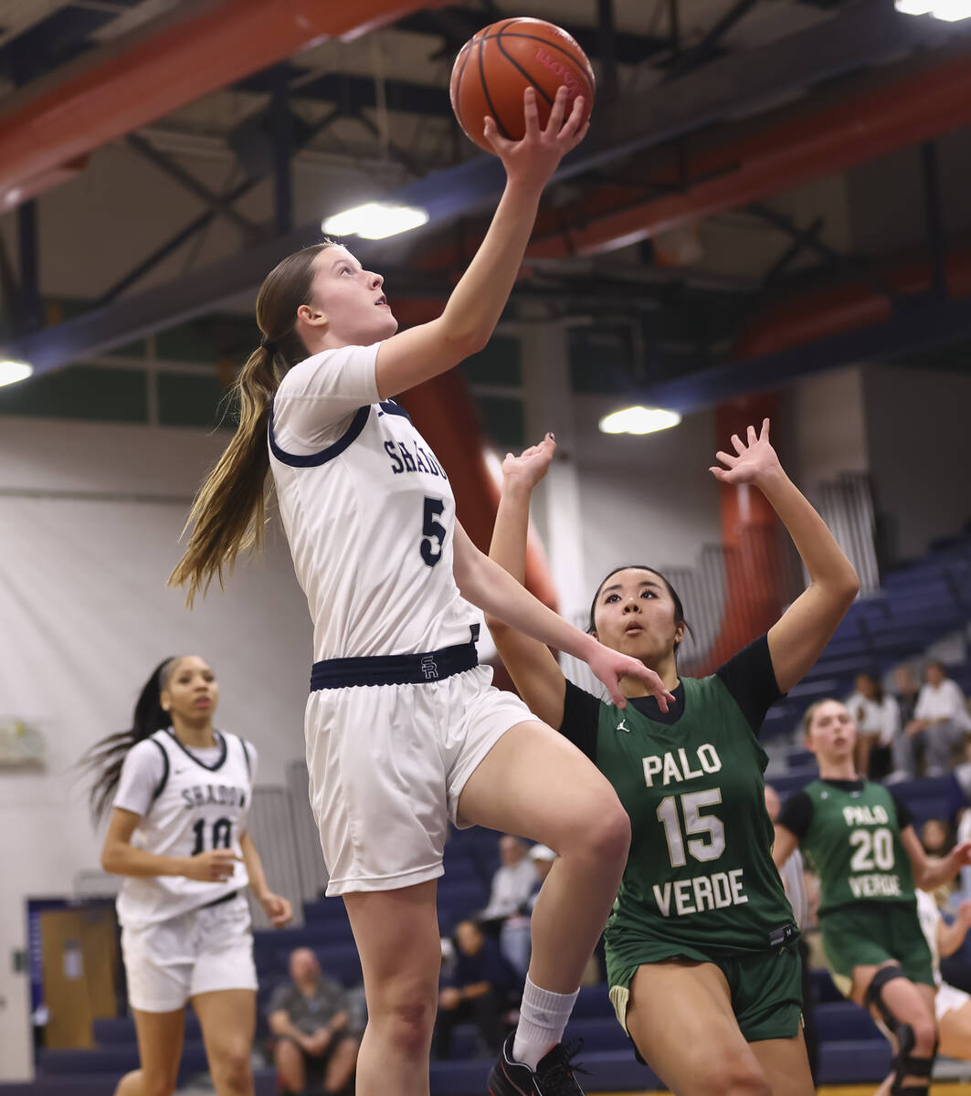 Shadow Ridge forward Alexa Madsen (5) lays up the ball against Palo Verde’s Madeline Tsu ...