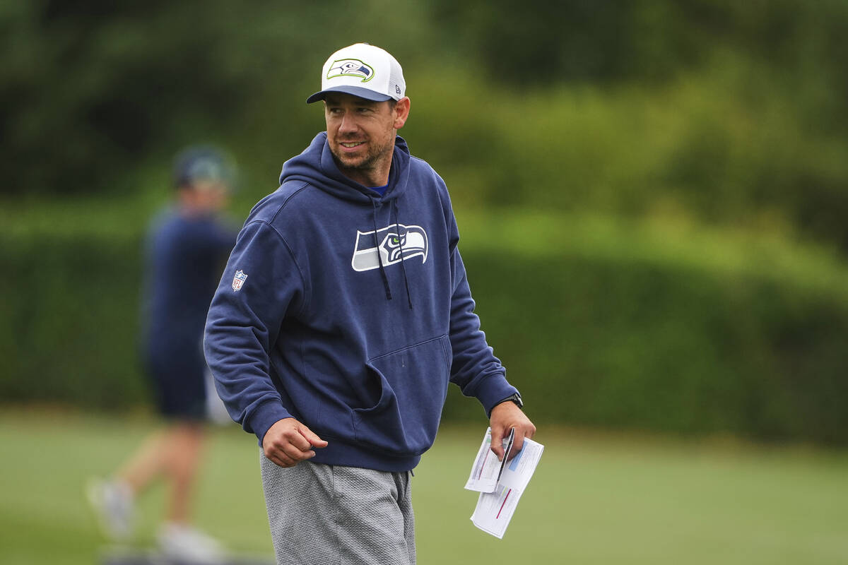 Seattle Seahawks offensive coordinator Klint Kubiak walks on the field during the NFL football ...