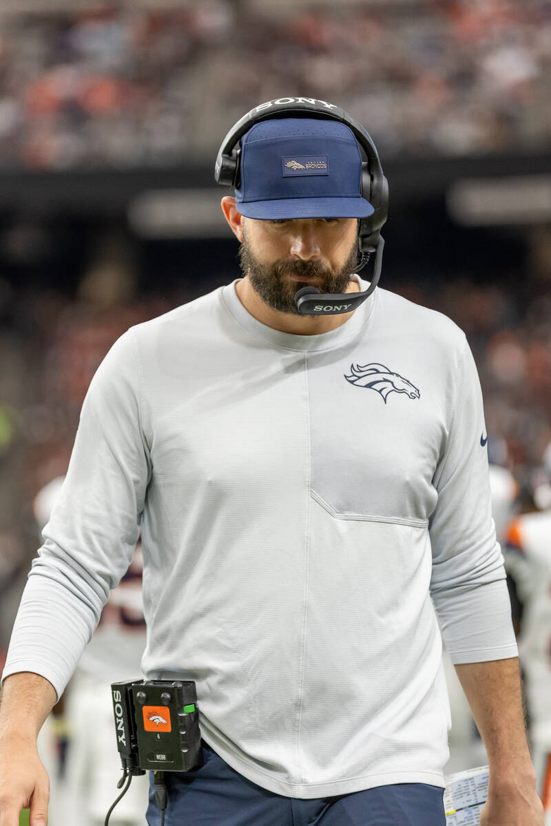 Denver Broncos offensive pass game coordinator/quarterbacks coach Davis Webb coaches against th ...