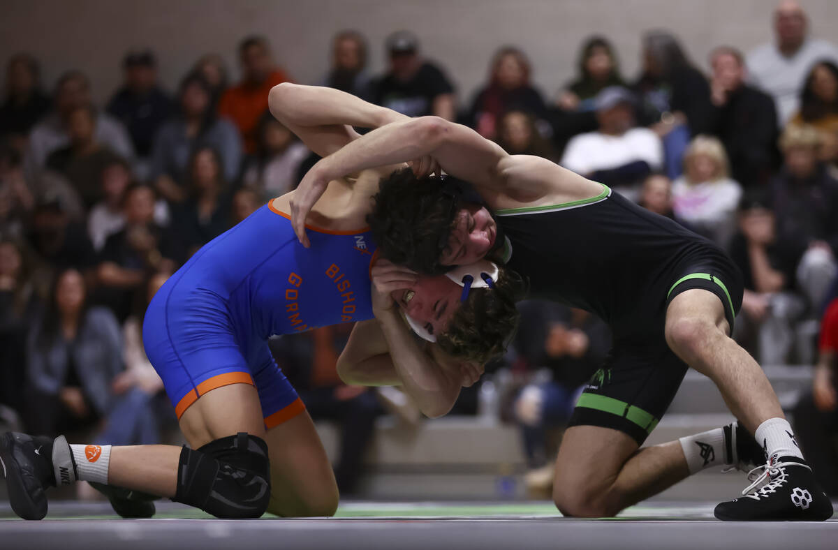 SLAM! Nevada’s Drake Hooiman, right, competes against Bishop Gorman’s Cash McFate ...