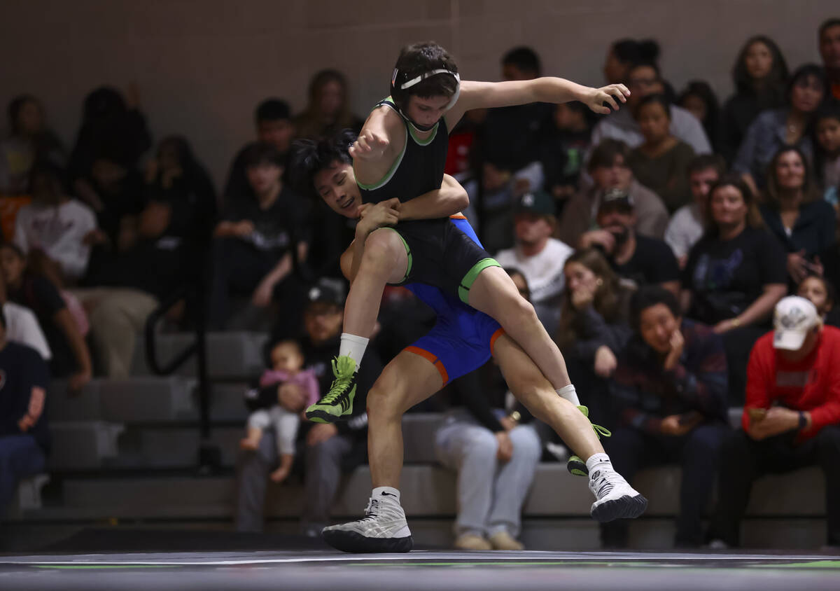 Bishop Gorman’s Elijah Tabasa, left, competes against SLAM! Nevada’s Eric Bice du ...