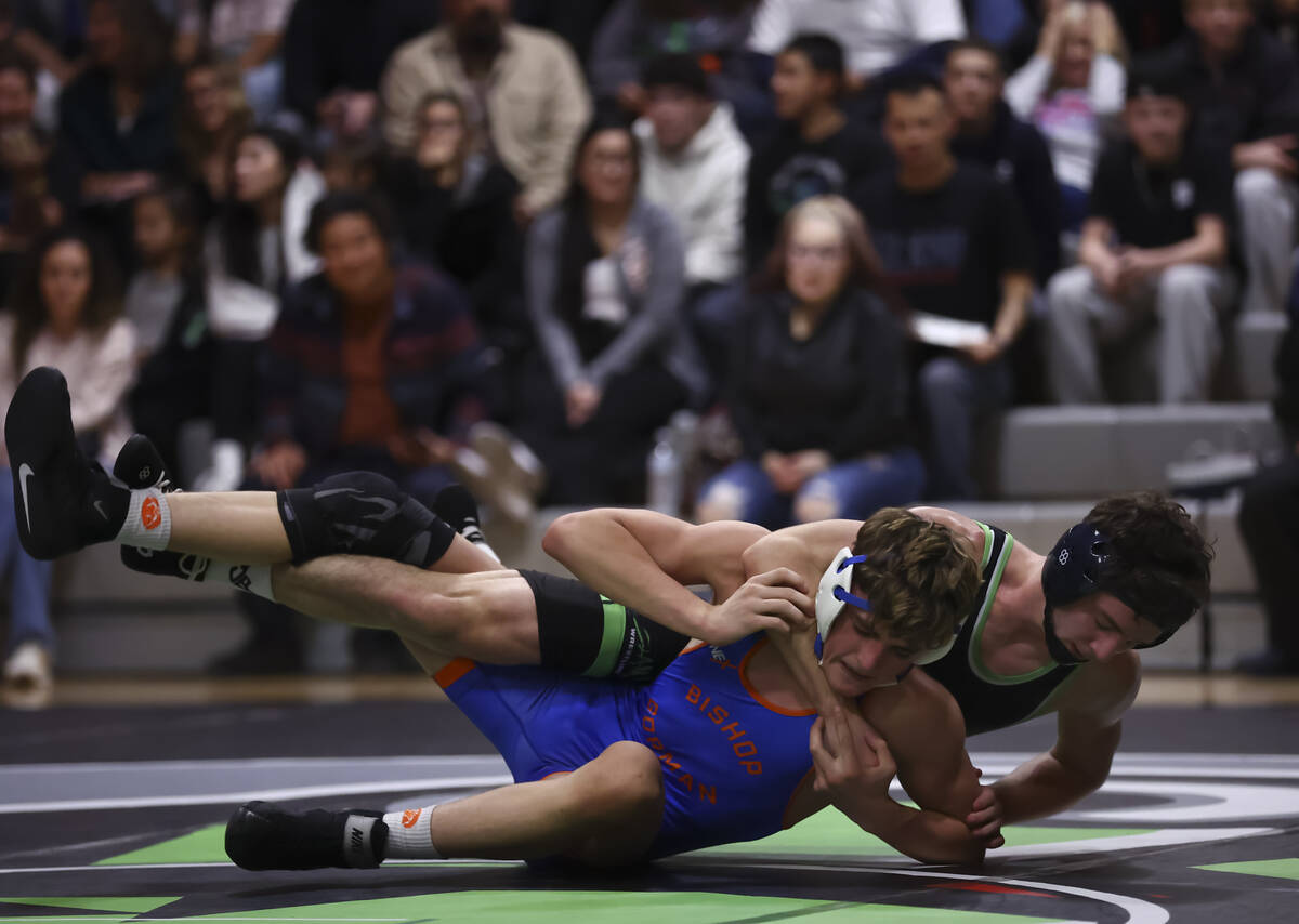 SLAM! Nevada’s Drake Hooiman, right, competes against Bishop Gorman’s Cash McFate ...