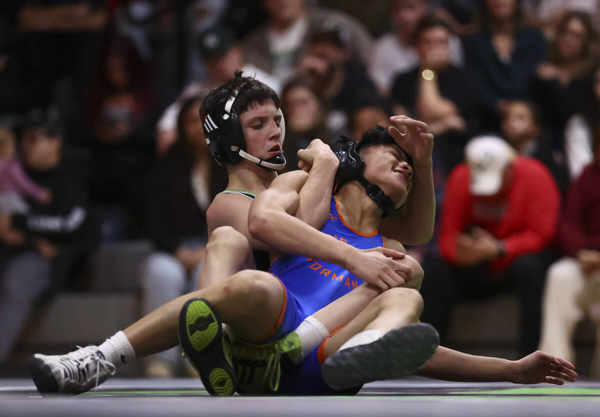 Bishop Gorman’s Elijah Tabasa, right, competes against SLAM! Nevada’s Eric Bice d ...