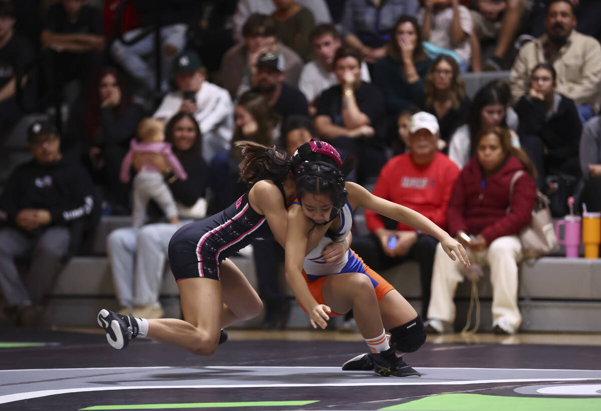 SLAM! Nevada’s Riley Esperanza, left, competes against Bishop Gorman’s Arya Esgue ...