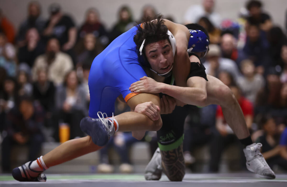 SLAM! Nevada’s Destin Maestas, right, competes against Bishop Gorman’s Connor Joh ...