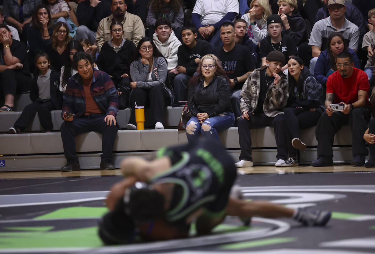 Attendees watch as SLAM! Nevada’s Destin Maestas, right, competes against Bishop Gorman& ...