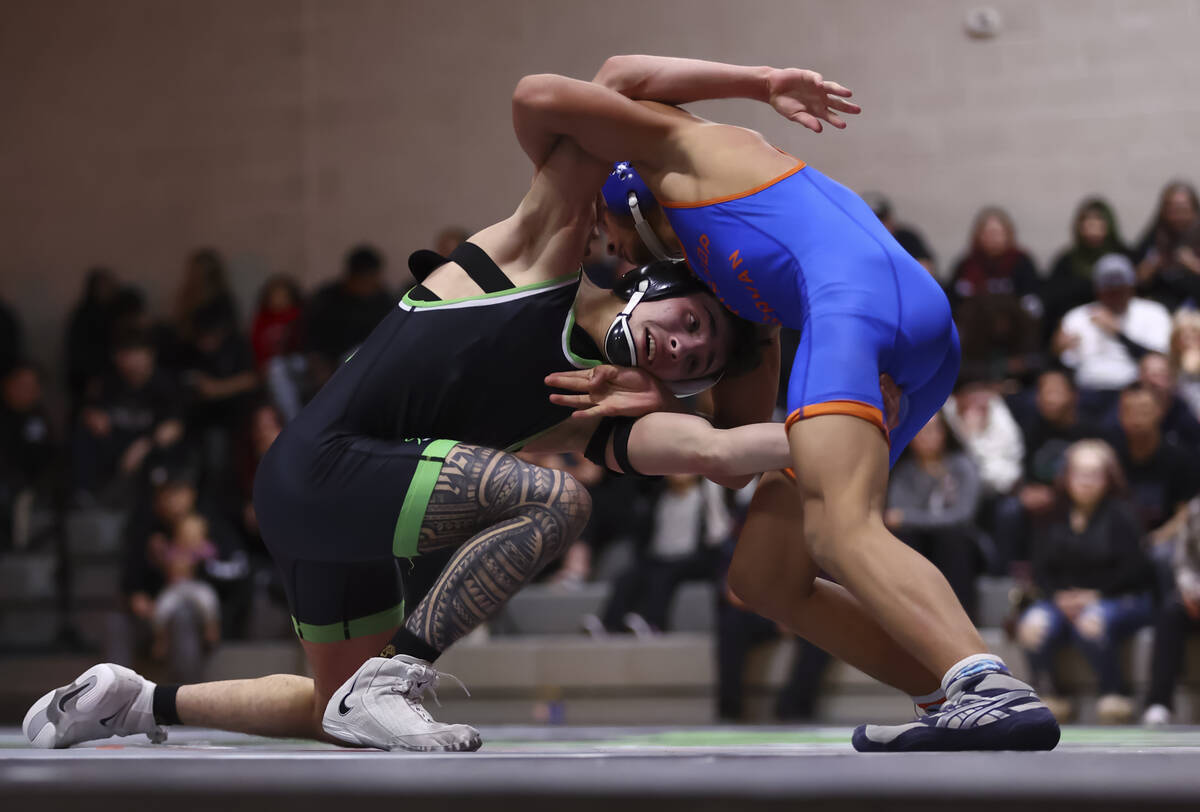 SLAM! Nevada’s Destin Maestas, left, competes against Bishop Gorman’s Connor John ...