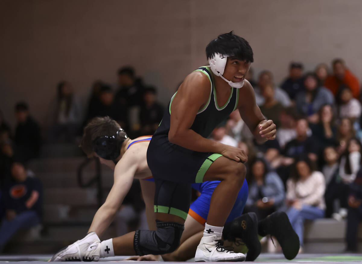 SLAM! Nevada’s Brenden Agacolli looks on after defeating Bishop Gorman’s Erik De ...