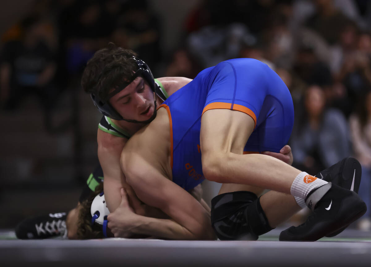 SLAM! Nevada’s Drake Hooiman, left, competes against Bishop Gorman’s Cash McFate ...