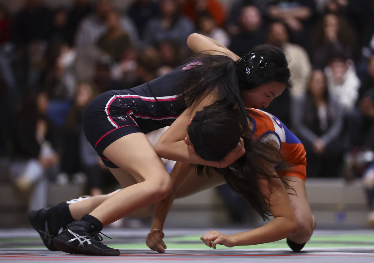 SLAM! Nevada’s Sienna Kim, left, competes against Bishop Gorman’s Sophia Allen du ...
