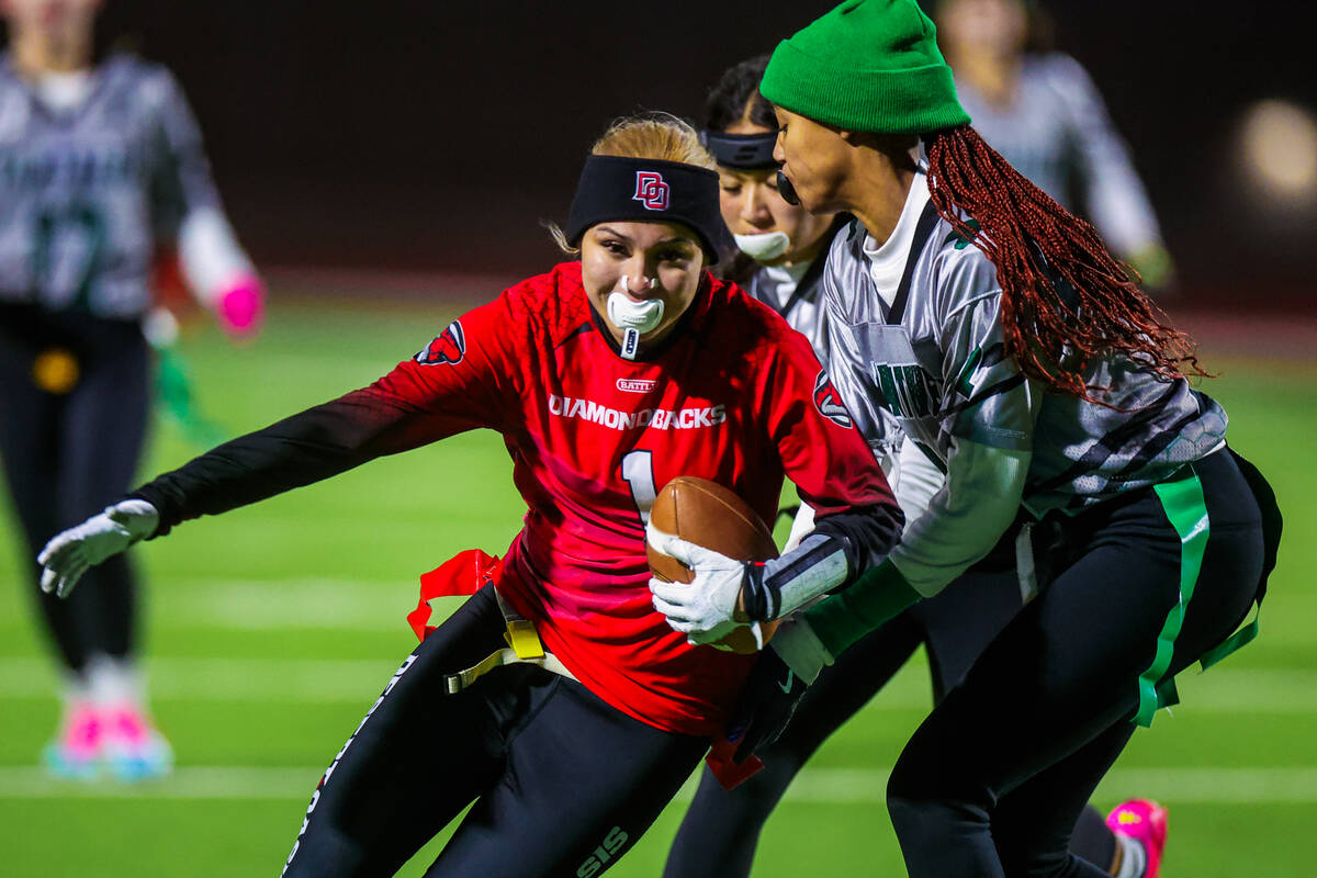 Desert Oasis wide receiver Kaydence Gerstel-Richardson (1) gets her flags pulled during a high ...