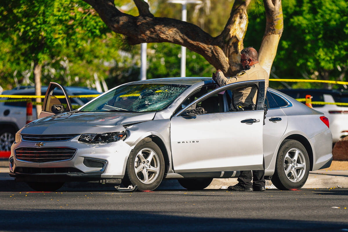 Metro police investigate a car after a female high school student was struck in front of Arbor ...