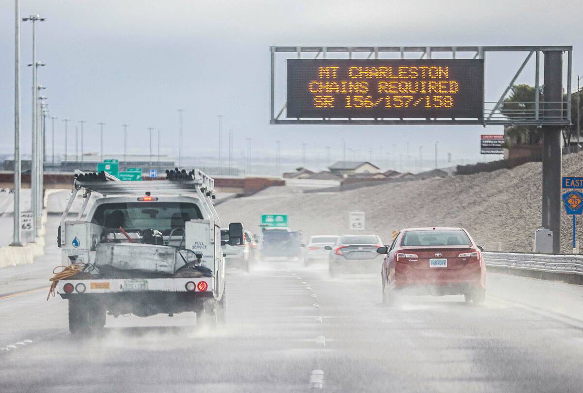 Vehicles drive through rain on Interstate 215 East Thursday, Jan. 8, 2026 in Las Vegas. (Benjam ...