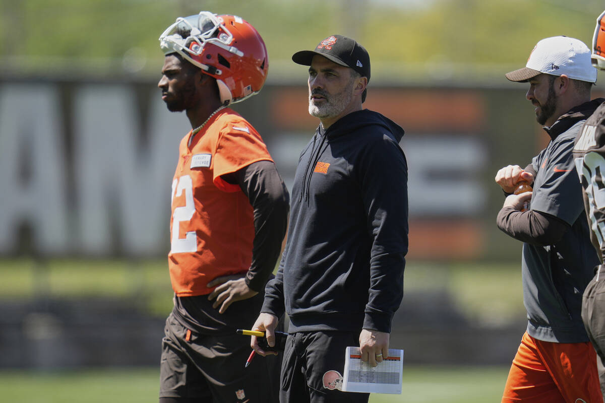 Cleveland Browns head coach Kevin Stefanski, center, walks on the field during the NFL football ...