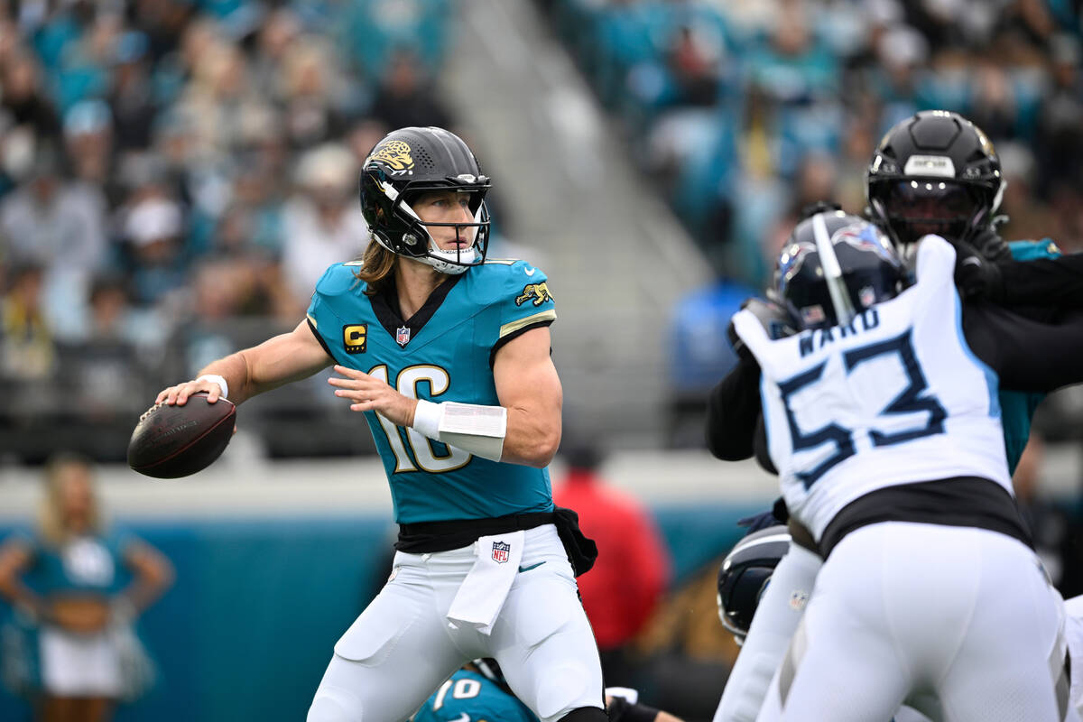Jacksonville Jaguars quarterback Trevor Lawrence (16) throws a pass against the Tennessee Titan ...