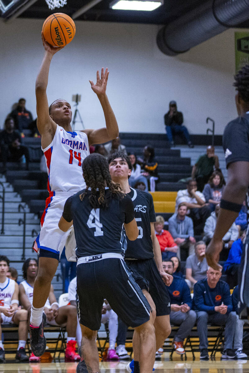 Bishop Gorman forward Kameron Cooper (14) shoots over Desert Pines guard Prince Davis (4) durin ...