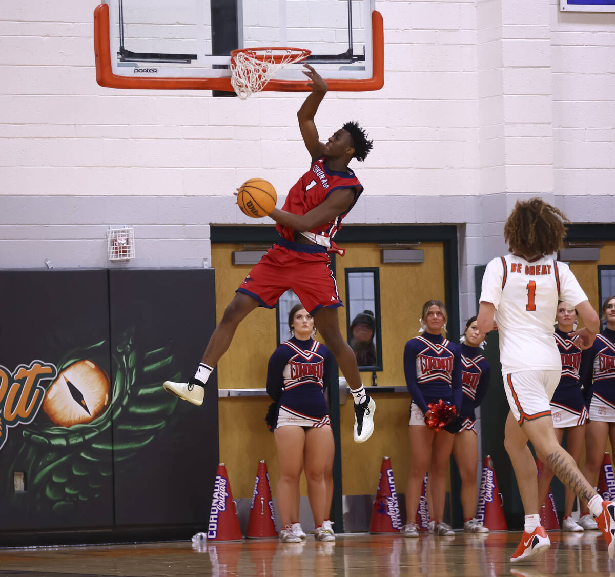 Coronado’s Munir Greig (1) dunks the ball during a basketball game at Mojave High School ...