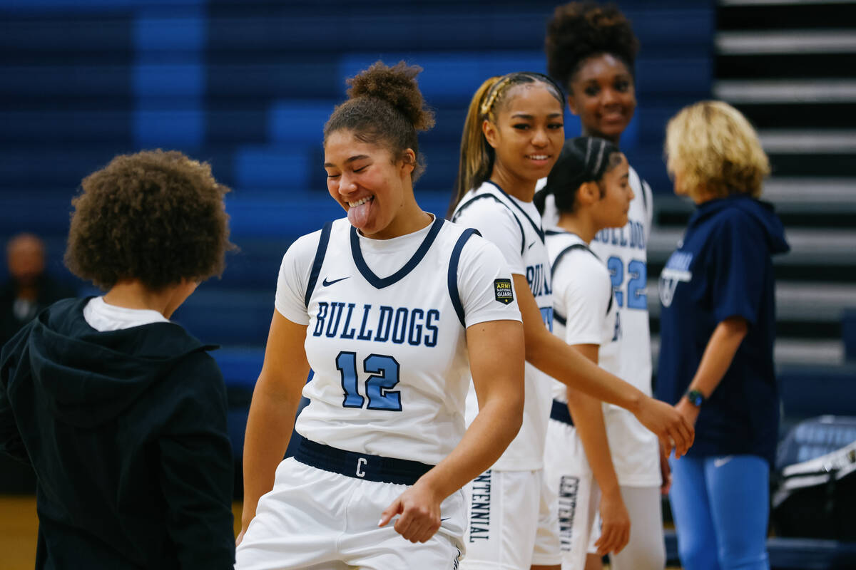 Centennial forward Nation Williams (12) grins as she’s introduced before the girlsȁ ...