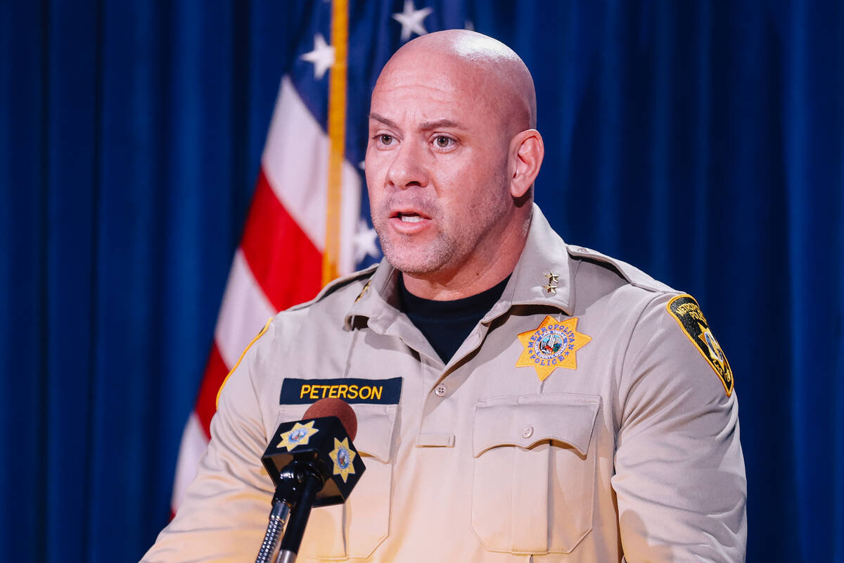 Metropolitan Police Assistant Sheriff Bryan Peterson briefs members of the media on a police sh ...